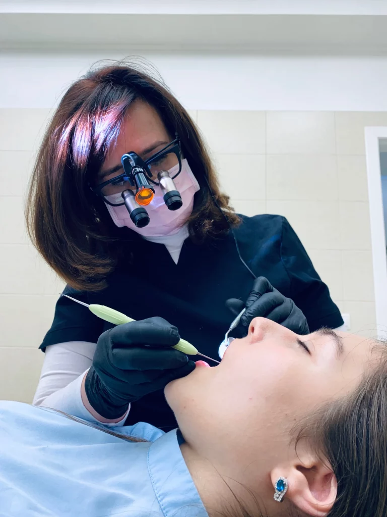 An Emergency dentist examining a patient's mouth